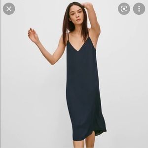 Navy Babaton slip dress from Aritzia.
